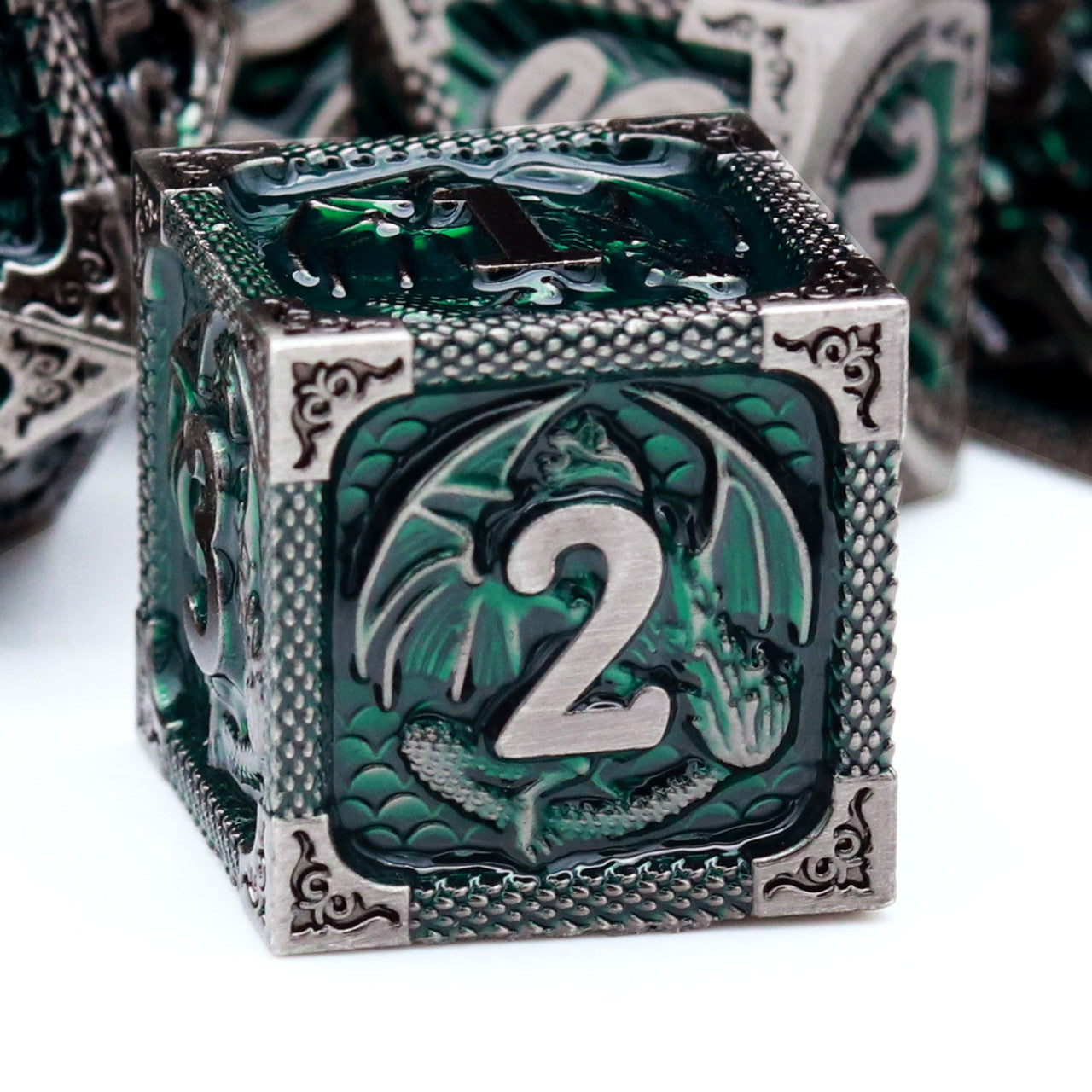 green metal dnd dice set with dragon pattern and dragon skin leather dice bag