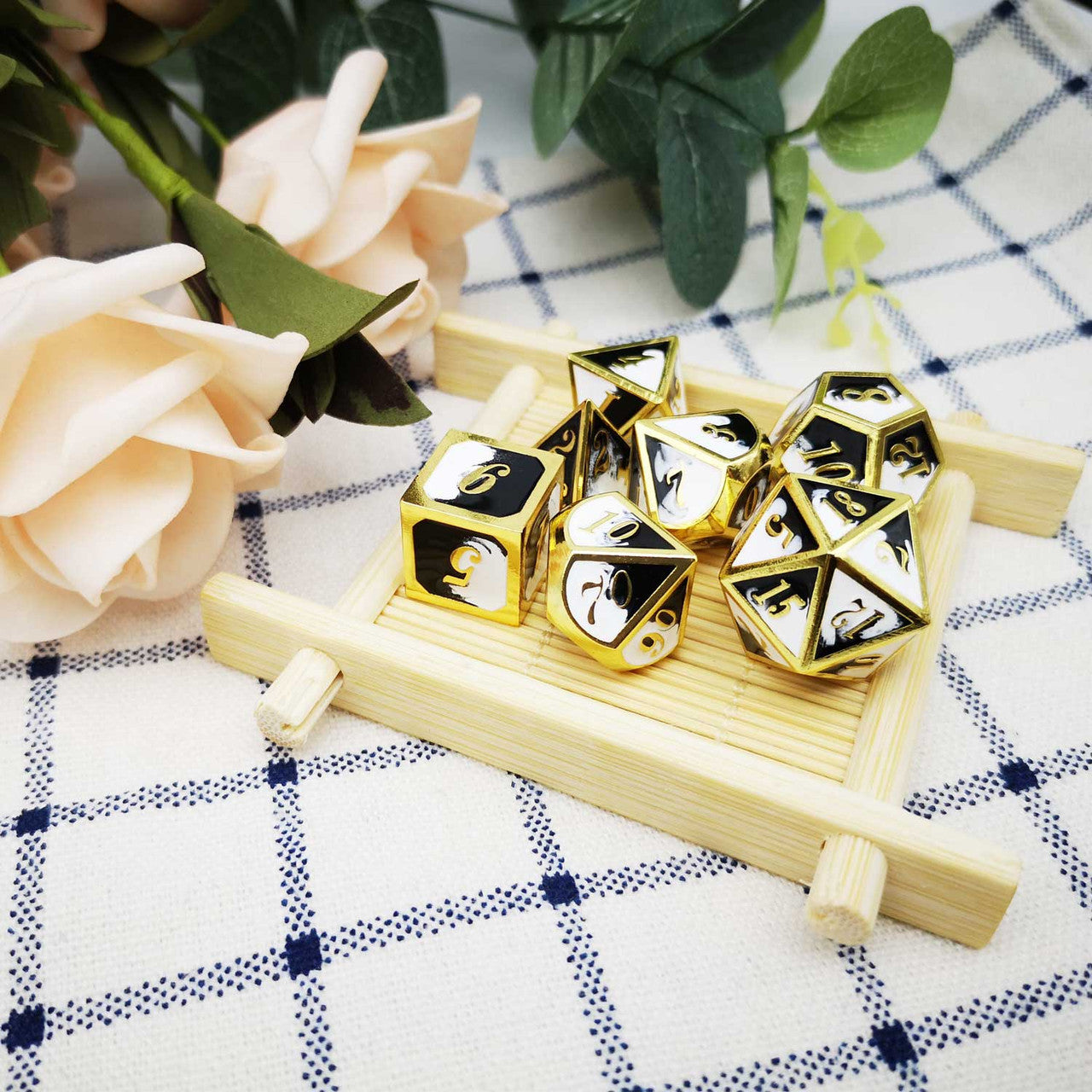 gold metal dice, black white dice, black dice, white dice