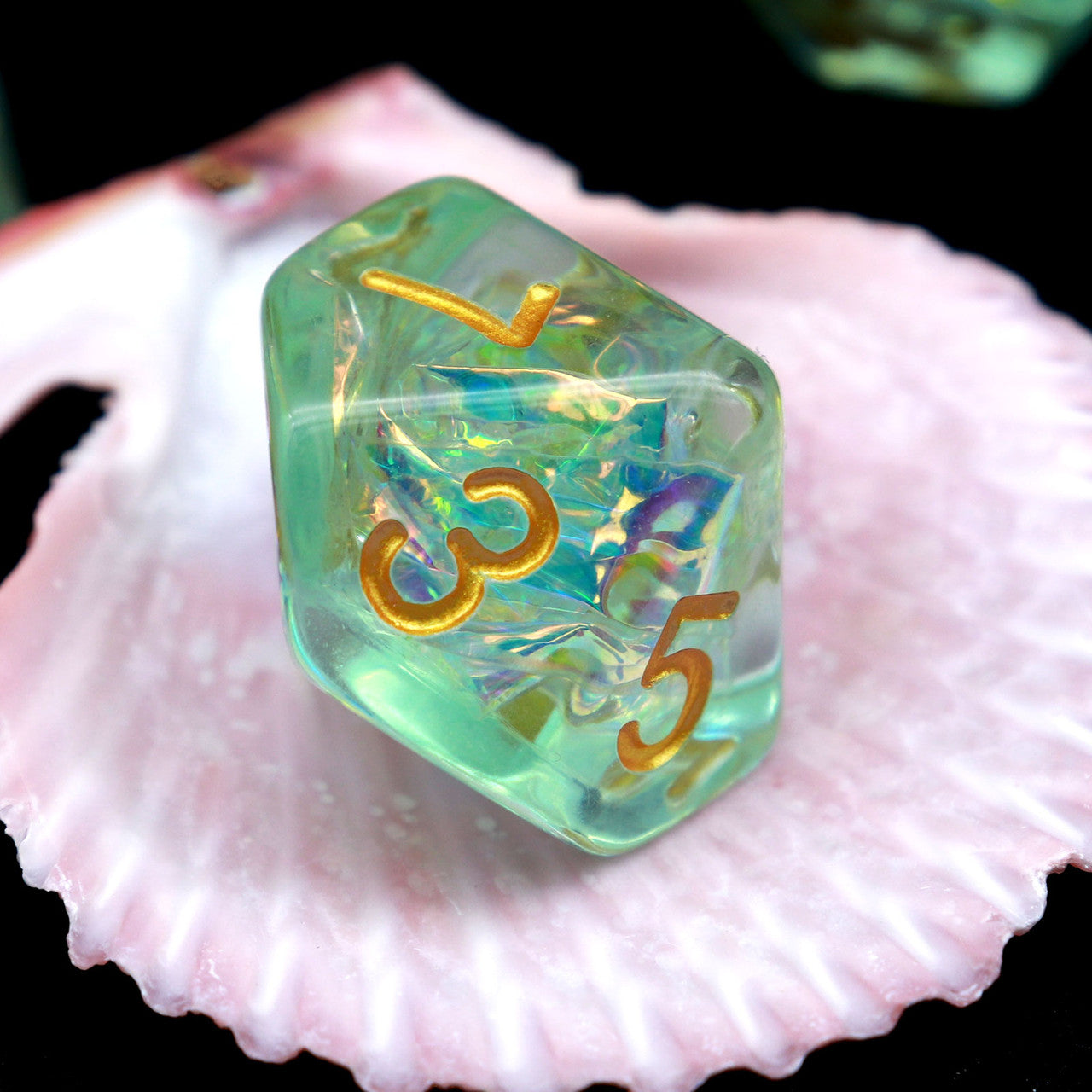 Iridescent dice, green dice