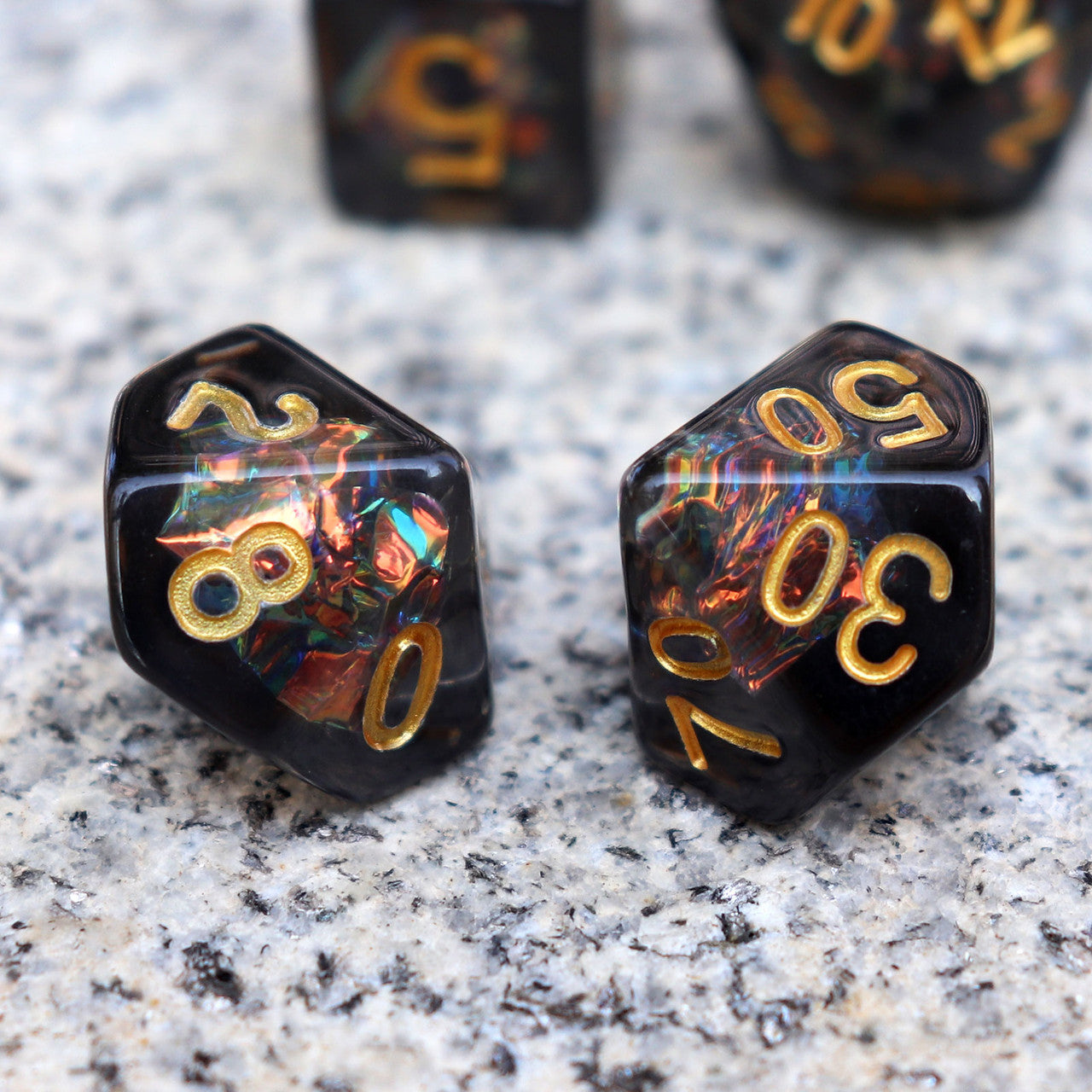 Iridescent dice, black dice