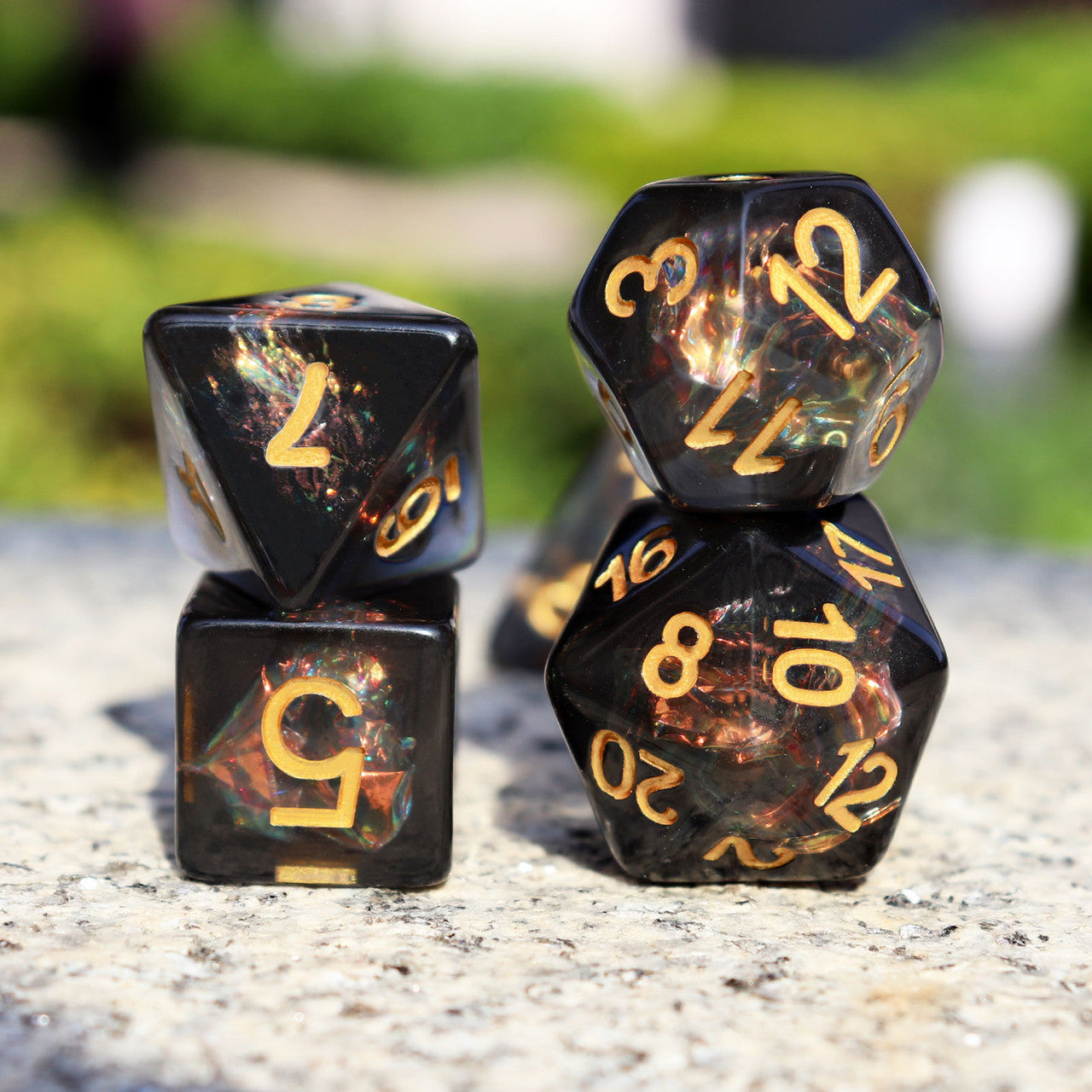 Iridescent dice, black dice