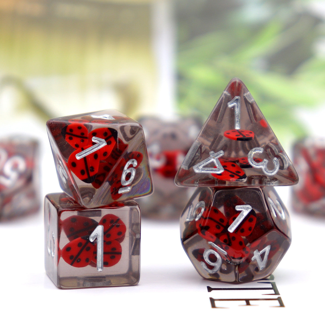 lady bug dice, resin dice, filled dice, red dice, grey dice, insect dice, rpg dice, polyhedral dice